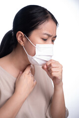 Asian woman is wearing mask on her face against coronavirus or COVID-19 disease. The Pollution Healthcare and virus pandemic concept.