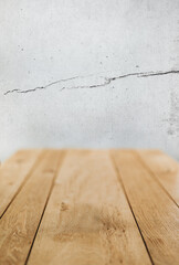 wooden table on gray wall texture