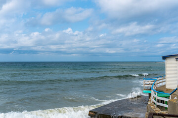 small storm on the sea, waves hitting the shore