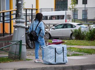 A girl is waiting for a taxi car