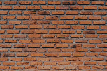 The red brick wall that was damaged and cracked