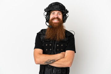 Redhead SWAT isolated on white background keeping the arms crossed in frontal position