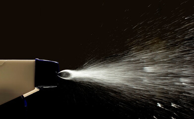 Spray bottle liquid detergent black background