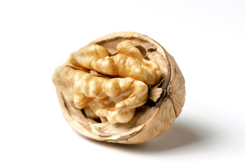 Walnuts on a white background. Nut - a source of vitamins and useful trace elements. Close up.