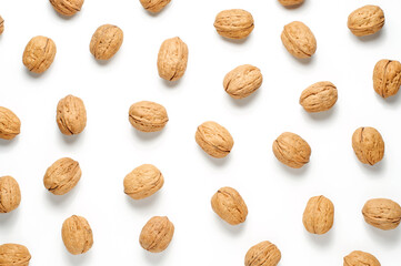 Walnuts on a white background. Nut - a source of vitamins and useful trace elements. Flat top view.