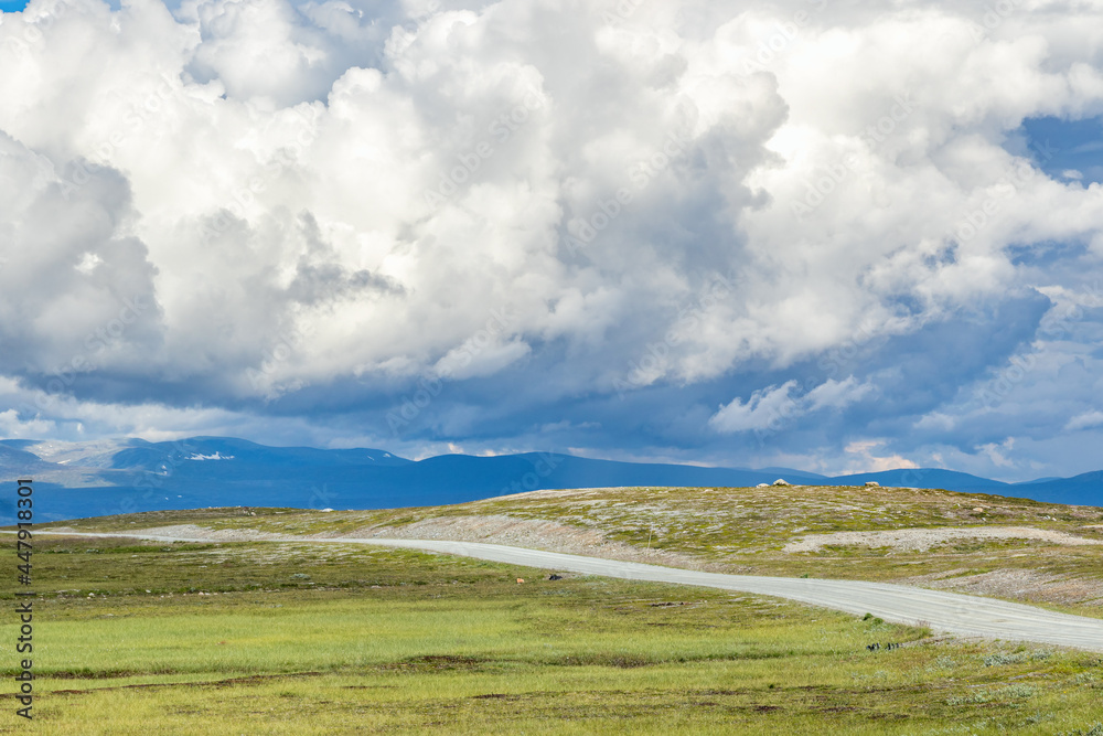 Canvas Prints Dirt road in high country landscape with a cloudscape in the sky