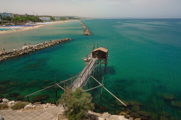 The fishing trebuchet over the amazing adriatic see at the beach of Termoli , Molise , Italy