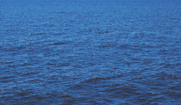 Texture of beautiful dark blue sea water