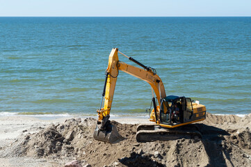 Zelenogradsk, Kaliningrad region, Russia - Jun 29, 2021: an excavator working on the Baltic Sea coast