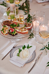 Assorted snacks on a festive New Year's table. Beautiful catering. High quality photo