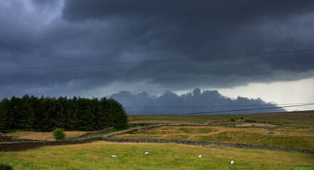 Fototapeta premium Storm clouds gather over Yorkshire moorland at 900ft