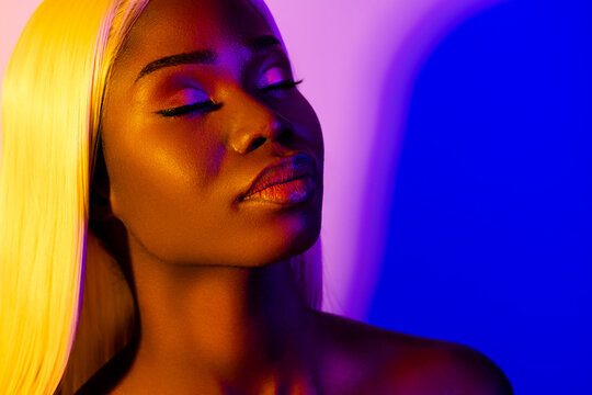 Photo of young sensual stunning gorgeous african woman with perfect flawless face isolated on colorful background