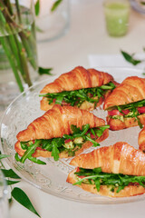 Mini croissants with filling on the festive table. Buffet, catering. High quality photo