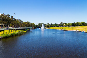Fototapeta na wymiar River Torrens flowing through parkland between Adelaide and North Adelaide, South Australia