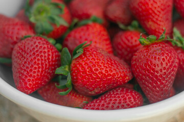 white bowl with fresh strawberries