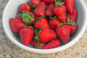 white bowl with fresh strawberries