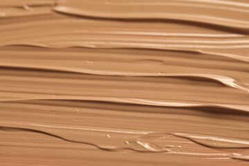 Texture of liquid skin foundation as background, closeup