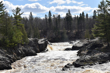 Jay Cooke State Park, Carlton, Minnesota 4-17-2021 - Handsome Man standing on Bluff above the churning water of the Saint Louis River