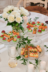 Assorted snacks on a festive New Year's table. Beautiful catering. High quality photo