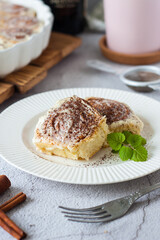 cinnamon buns made of pastry with cream sauce