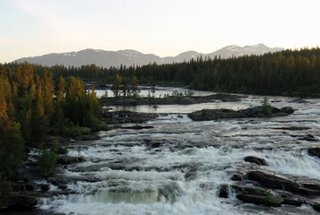 a large waterfall over a body of water