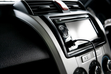 Close up USB cable on the car audio use connecting data car play and music Navigation system in the...