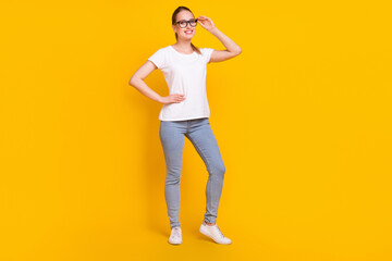 Fototapeta na wymiar Full size photo of cheerful young happy woman smile wear glasses smile isolated on shine yellow color background