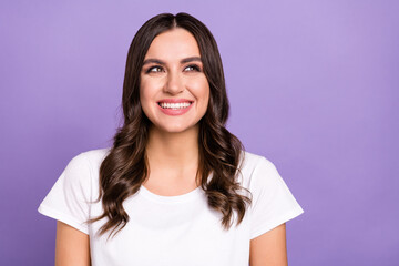 Fototapeta premium Photo of lovely brunette millennial lady look up wear white t-shirt isolated on violet color background