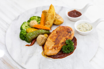 Griled chicken breast steak with vegetable  , Grilled chicken fillets on slate plate