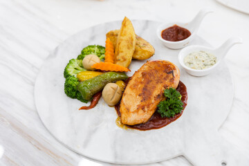 Griled chicken breast steak with vegetable  , Grilled chicken fillets on slate plate