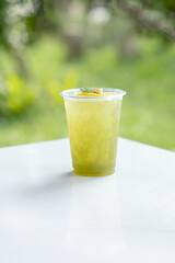 Cold cocktail with lime and honey , Lime drink with ice