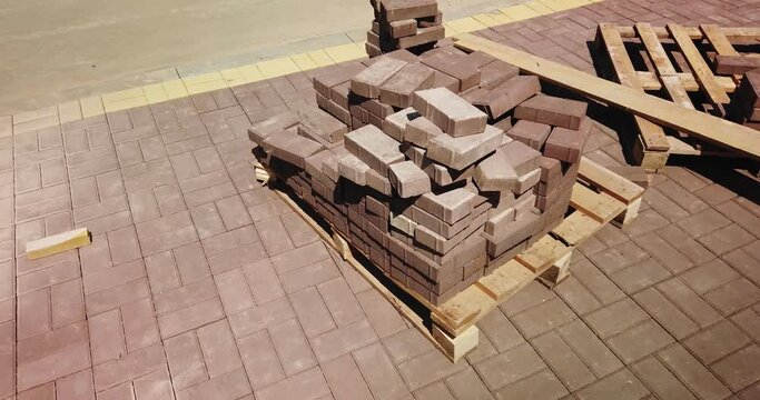 Pile of prick tiles for pavement work dolly shot.