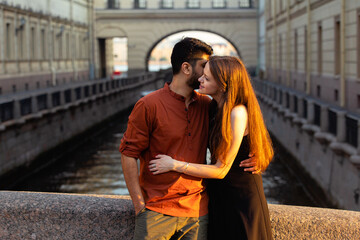 Fototapeta premium love story of young hindu guy and european beautiful girl at dawn