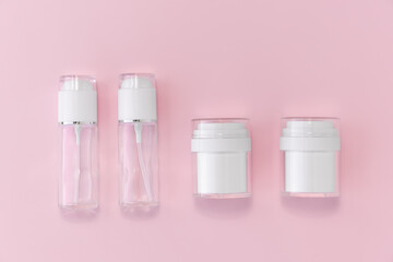 Reusable glass white bottles for oil, cream, lotion or serum on a pink background. Zero waste, eco-friendly. Layout of the beauty salon branding. Natural cosmetics