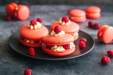 Macaroons. Delicious french desserts. Macaroons with raspberries and cream cheese. Macaroons on the table