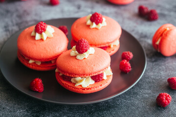 Macaroons. Delicious french desserts. Macaroons with raspberries and cream cheese. Macaroons on the table