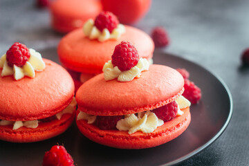 Macaroons. Delicious french desserts. Macaroons with raspberries and cream cheese. Macaroons on the table