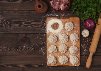 Traditional Georgian dish, Khinkali, raw, cooking, preparation, on a wooden table, top view, no people, selective focus, rustic style,