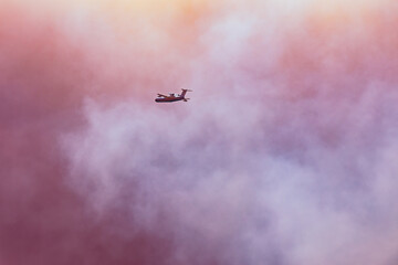 Forest fire in Manavgat Antalya Turkey, fire fumes, smokes in the city, fire planes and helicopters trying to put out the fire.