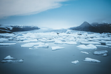 Awesome view of ice blocks in lake Fjallsarlon. Location place Vatnajokull National Park, Iceland. - Powered by Adobe