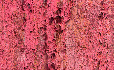 Rusty abstract background with peeling red paint