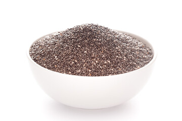 Close-up of dry organic chia seed (salvia hispanica ) in a white ceramic bowl over white background.
