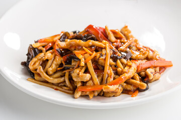 Chinese cuisine sour and sweet fried pork with vegetables isolated on white background
