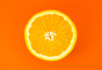 Fototapeta na wymiar Close up photo of orange texture on the orange background. Fruit cut in half, inside, macro view. Minimalism, original and creative image. Beautiful natural wallpaper.