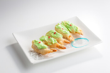 deep fried shrimp in wasabi sause isolated on white background