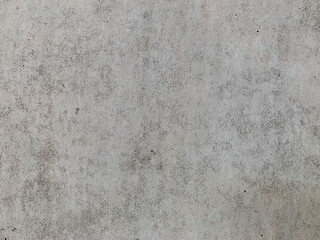 Fototapeta premium Concrete surface texture close up. Detailed pattern on a precast concrete wall. Perfect background for creative projects. Copy space, minimal photo. 