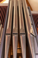 Vertical closeup shot of organ pipes