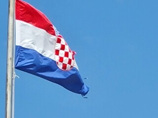 Croatian flag on blue sky. Country flag against sky. Flags of the world