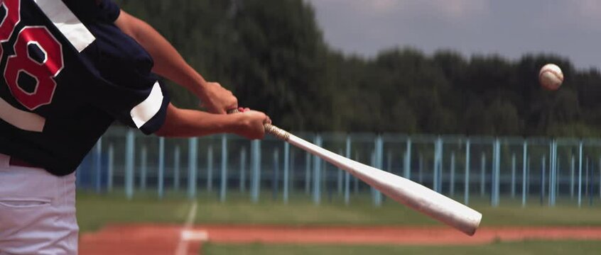 Kid Boy Batter Baseball Player Hits A Ball Over A Home Plate. Super Slow Motion, Shot With High Speed Camera At 420 FPS 