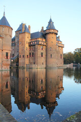 medieval castle with reflection in water